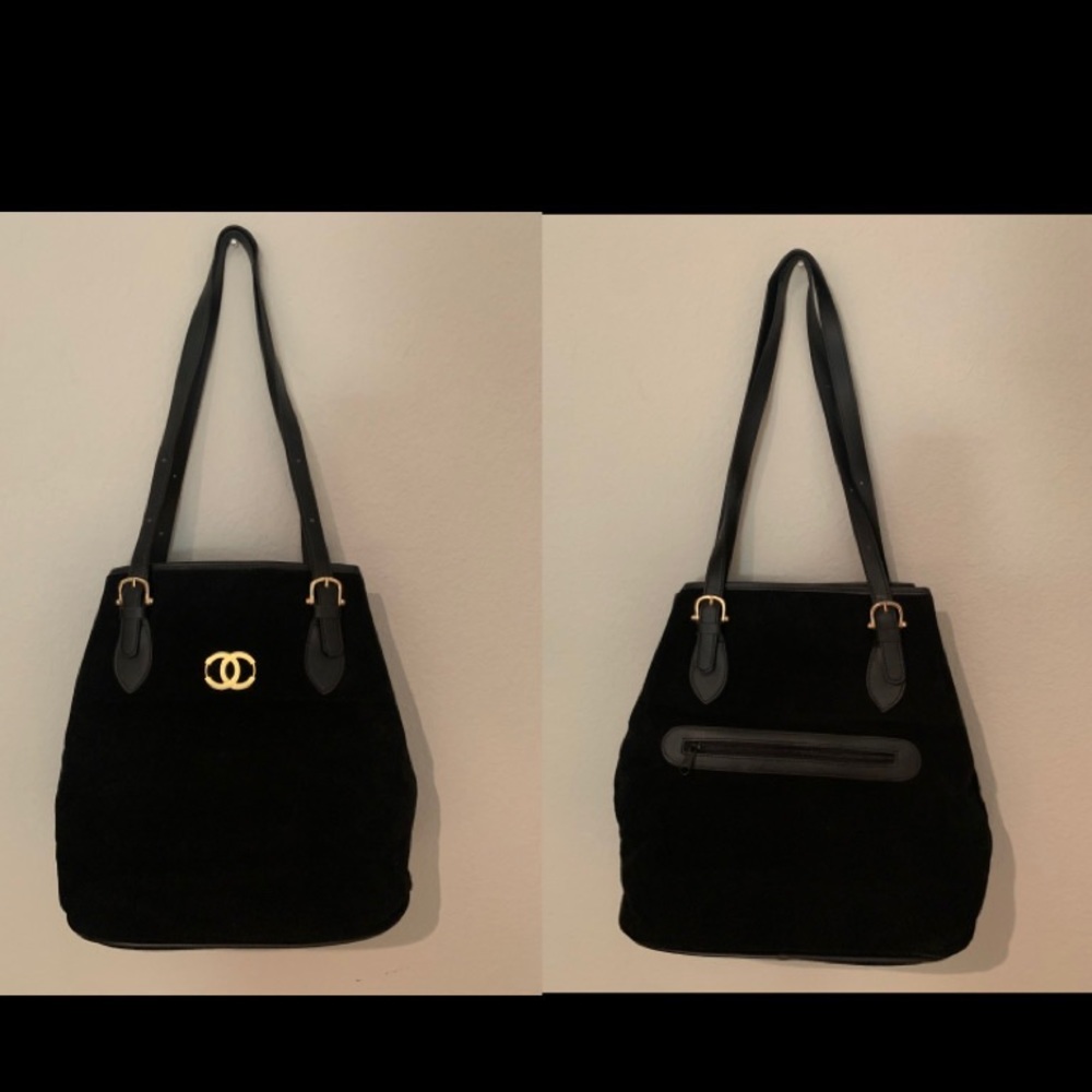 Elegant Black suede purse. It was give to me as a gift. Never used. Brand new.